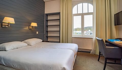 Unit with 2 Single Beds. Exact unit will be assigned upon arrival. Views, colors, and decor may vary.