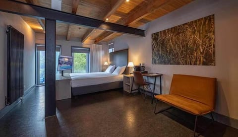 Settle into a spacious retreat under warm, rustic beams.