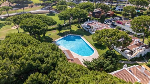 A sun-drenched pool set within lush, serene gardens and surrounded by tall pine trees.
#PoolsideLiving #AlgarveLifestyle #HolidayMode #Portugal #Vilamoura