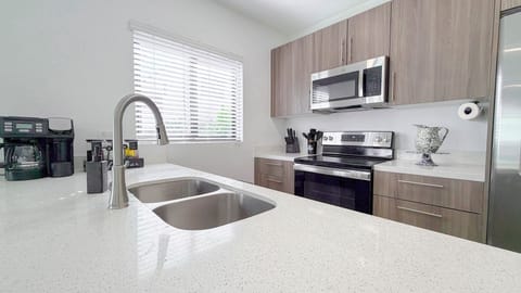 Modern kitchen sink and countertops—clean, functional space for meal prep