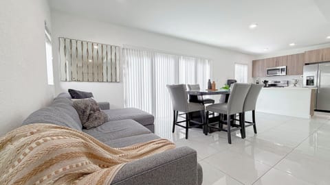 Bright living and dining area—spacious, modern design for gathering and relaxing