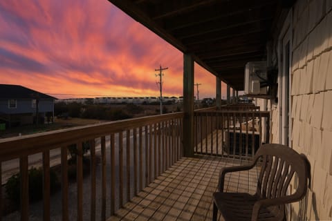 Private balcony at sunset — unwind with coastal views and fresh ocean air just minutes from the beach in Surf City.