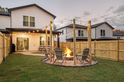 Fenced Backyard with fire it  