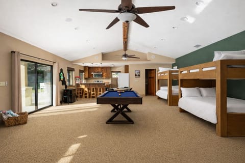 Pool house /  game room with bunk beds and games (not pictured is a new sofa to enjoy the large TV!)