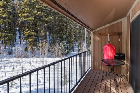 Step onto your private balcony and breathe in the crisp mountain air while enjoying stunning winter forest views from your cozy retreat.
