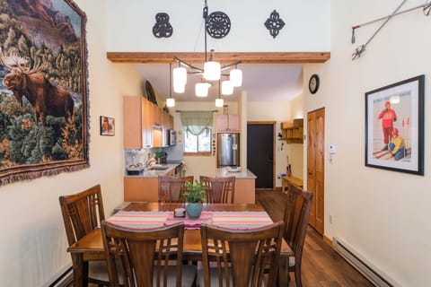Gather around your welcoming dining table, where rustic charm meets mountain comfort in this thoughtfully decorated space.