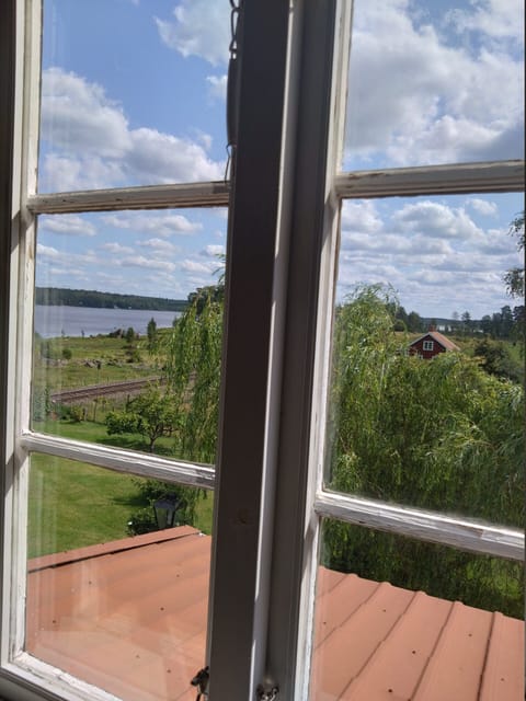 Charming red and white holiday home with lake view near Vimmerby House in Kalmar County, Sweden