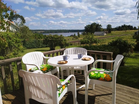 Charming red and white holiday home with lake view near Vimmerby House in Kalmar County, Sweden