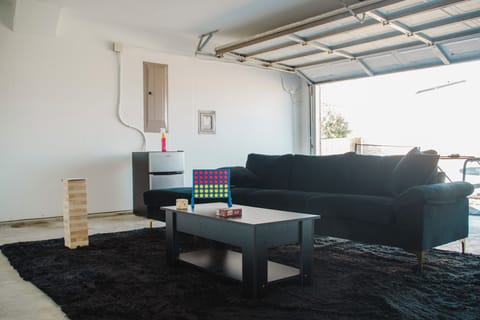 The garage filled with fun, ping pong, large jenga, cards, connect 4 and more