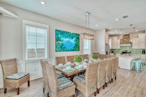 1st Floor - Generous dining space with seating for 12 at the main table, 4 at the kitchen island, and 12 more at the outdoor dining table—perfect for large group meals, celebrations, and gathering together indoors or outside.
