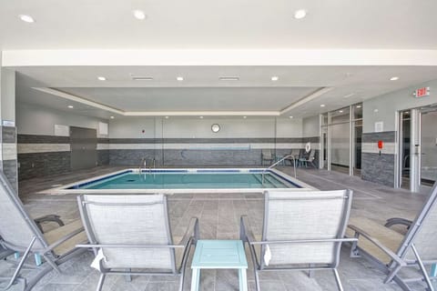 Lounge poolside after a swim in a calm indoor setting.