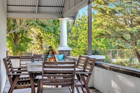 The wide wraparound verandah is ideal for outdoor dining, morning coffee or sunset drinks overlooking the lush surrounds.