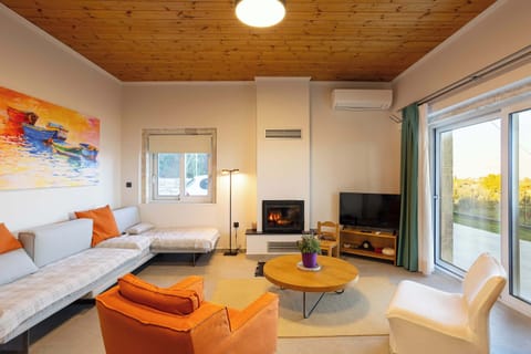 Living space with large doors opening to the terrace