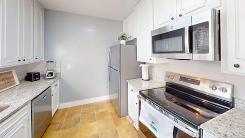 The kitchen is fully equipped wit a stove, dishwasher, refrigerator/freezer w icemaker, microwave and cooking utensils, dishes and silverware and cookware