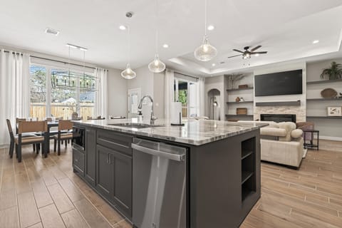 Open layout connects seamlessly to the living area, creating a welcoming flow.