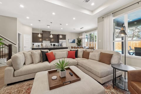 Modern elegance with cozy textures and a perfect view of the outdoor patio.