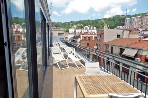 Breathe in panoramic views while sharing drinks on the balcony.