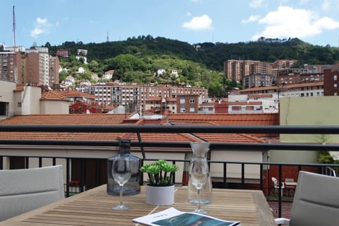 Sip morning coffee on the balcony with sweeping hillside views