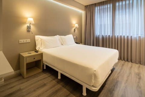Unwind in crisp linens and soft, calming ambient light.