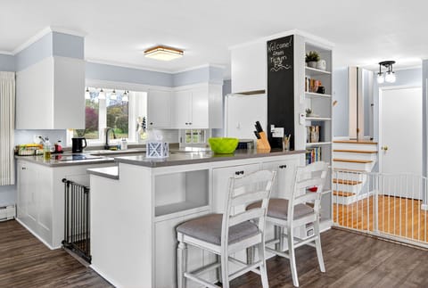 The heart of the home—an open kitchen with a spacious island, bar seating, and an easy flow that’s perfect for morning coffee or casual meals together.