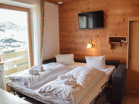 Furniture, Interior Design, Chair, Room, Ceiling, Wood Stain, Living Room, Kitchen & Dining Room Table, Hardwood, Hotel