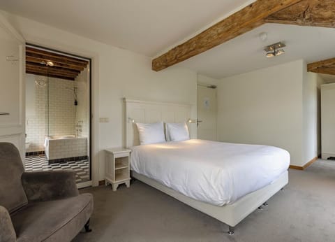 Step from bed to bathroom effortlessly in this comfortable suite.