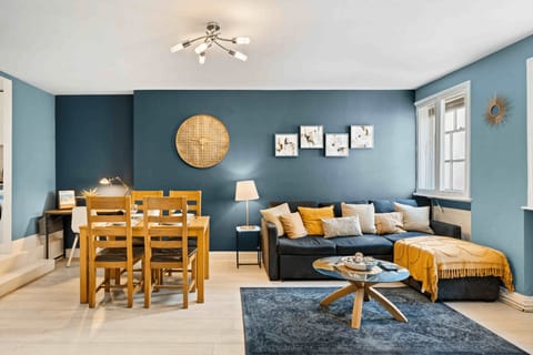Bright, stylish living area with comfy L-shaped sofa and smart TV 
