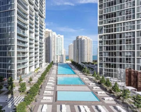 Resort-style pool deck at Icon Brickell with panoramic skyline views.