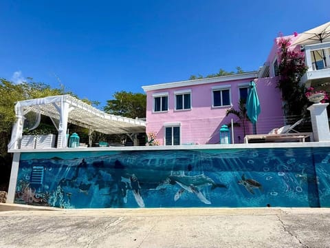 Exterior view of 2nd floor balcony, pool, and our beautiful Ocean Life Mural painted by Water Island artist Colleen Tapp