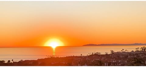  Sunset glow over the Pacific from balcony with Catalina Island silhouette.