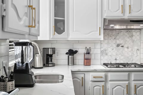 Fully equipped kitchen with modern appliances and ample counter space.