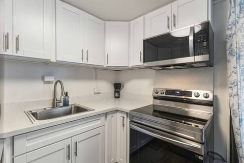 Bright mornings, easy meals.   Whip up breakfast in this clean, modern corner with stainless steel style.