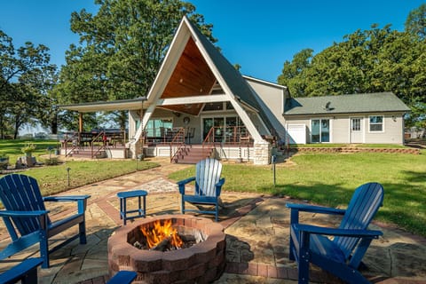 Lake side view of the house with a large deck