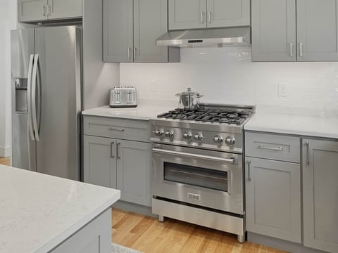 Dual fuel range, dishwasher, disposal, microwave oven.