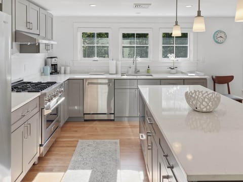 Dual fuel range, dishwasher, disposal, microwave oven.