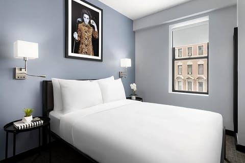 Lounge peacefully in a stylish room with bright window views.