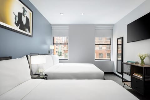 Wake up to city light in a bright, airy retreat.