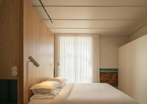 Drift into deep sleep in crisp linens and soft daylight.