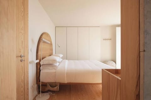Settle in with soft lighting and calm, uncluttered design.
