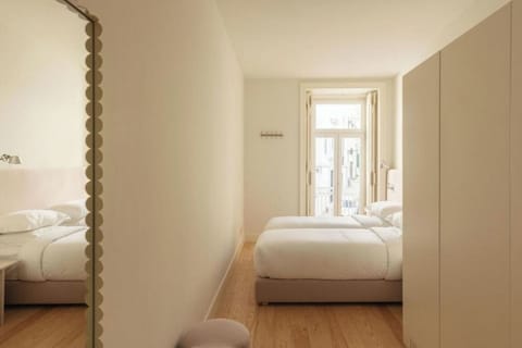 Settle into twin beds after a day exploring nearby streets.