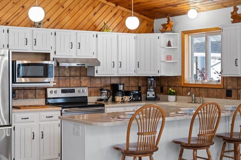 Bright, updated kitchen with ample counter space, coffee station, and everything you need to prepare meals with ease.