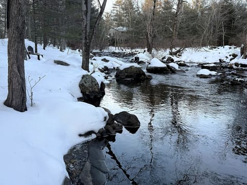 “Morning coffee and evening wine beside your private Pocono stream”
