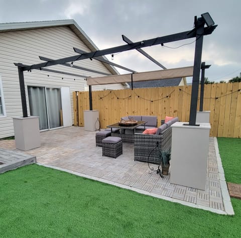Relax outdoors on the private patio, string lights, comfortable seating