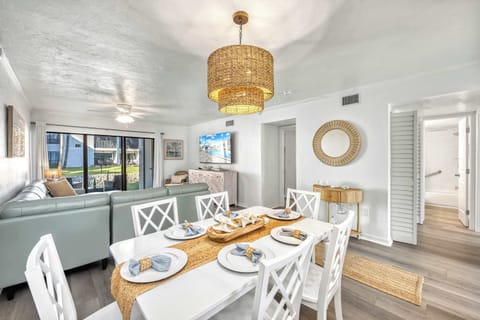 Open-Concept Living & Dining – Formal dining table with seating for six, additional breakfast bar stools for even more flexible seating