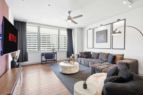 Stretch out in a spacious living room with plush sectional seating and streaming ready TV. Perfect for movie nights, catching the game, or relaxing after a full day downtown.