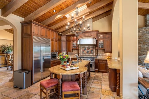 Kitchen: fully stocked kitchen with stainless steel appliances (double range, built in french door refrigerator, built in oven and microwave, dishwasher), 2 bar stools