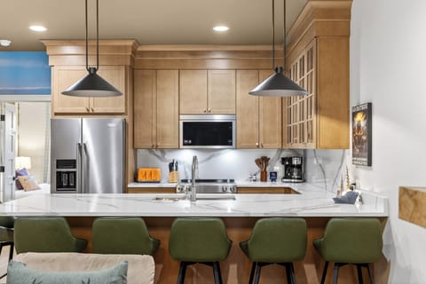 Fully equipped kitchen with a roomy island—grab a seat at the breakfast bar and keep the conversation going.