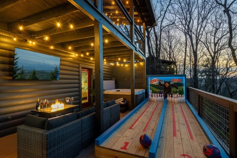 Enjoy bowling, the hot tub, or a fire watching TV.