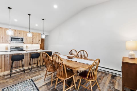 Gather around your spacious dining table for memorable meals in this warm, modern space with beautiful wood accents.
