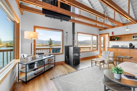 Relax in your bright open-concept space with stunning lake views, cozy fireplace, and modern amenities.